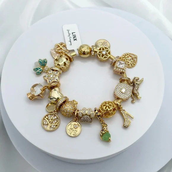 Linx Yellow Gold Bracelet with Gold and Green Themed Charms